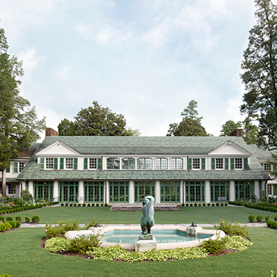 Front of Reynolda House Museum of Art with a fountain and gardens in the foreground