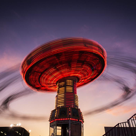 A ride spins at the Carolina Classic Fair in Winston-Salem, NC