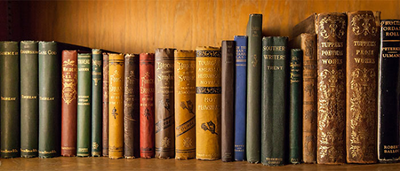 A row of rare books in the ZSR Library Special Collections & Archives