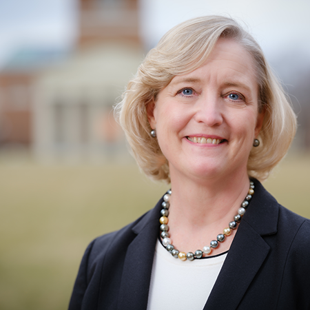 Photograph of Dr. Susan R. Wente with Wait Chapel in the background
